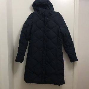The North Face coat in dark blue color.